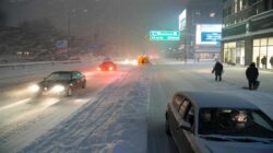 Heavy snow is set to begin tonight as authorities urge drivers to stay home, even while businesses push to operate as usual